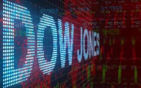 Cyfrowy wykres giełdowy z napisem "DOW JONES" w formie pikseli. Kolory czerwony i niebieski dominują, sugerując zmienność rynku. Dow Jones co to? To jeden z najważniejszych indeksów giełdowych.